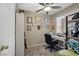 Home office featuring desk, overhead fan, and wall decorations at 8100 Artistic Heights Ct, Las Vegas, NV 89143