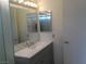 Stylish bathroom featuring a sleek vanity and a large mirror, offering a comfortable and modern space at 8501 Stan Crest Dr, Las Vegas, NV 89134