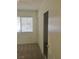 Bright bedroom featuring carpet flooring, a window with blinds, and a closet with sliding doors at 8501 Stan Crest Dr, Las Vegas, NV 89134