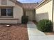 Covered front porch with desert landscaping that provides a welcoming entry to the home at 8501 Stan Crest Dr, Las Vegas, NV 89134