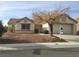 Charming single story home with neutral exterior, desert landscaping, and a covered front porch at 8501 Stan Crest Dr, Las Vegas, NV 89134