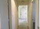 Inviting hallway with tiled flooring leads to the front door, creating a warm and welcoming atmosphere at 8501 Stan Crest Dr, Las Vegas, NV 89134