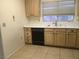 Efficient kitchen space with tile flooring, neutral cabinets and built-in appliances at 8501 Stan Crest Dr, Las Vegas, NV 89134