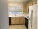 Practical kitchen layout with tile flooring, classic cabinets and basic appliances at 8501 Stan Crest Dr, Las Vegas, NV 89134