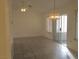 Cozy living room with neutral walls, tile flooring and access to a private balcony at 8501 Stan Crest Dr, Las Vegas, NV 89134