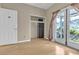 Bright bedroom with wood floors, closet, and french doors leading to the outside at 897 Cavaison Ave, Las Vegas, NV 89123