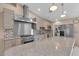 Modern kitchen showcasing stainless steel appliances, granite countertops, gas range, and decorative backsplash at 897 Cavaison Ave, Las Vegas, NV 89123