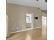 Bright living room with wood floors and an open floor plan and view to the kitchen and outdoor area at 897 Cavaison Ave, Las Vegas, NV 89123