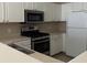 Well-equipped kitchen features white cabinetry, stainless steel appliances, and durable countertops at 9000 Las Vegas Blvd # 2220, Las Vegas, NV 89123