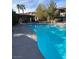 Community pool area with lounge chairs, umbrella tables and a covered outdoor kitchen at 9000 Las Vegas Blvd # 2220, Las Vegas, NV 89123