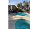 Community pool and hot tub surrounded by lounge chairs and tropical landscaping at 9000 Las Vegas Blvd # 2220, Las Vegas, NV 89123