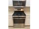 Stainless steel gas range oven and microwave in a kitchen with white cabinets and light countertops at 9000 Las Vegas Blvd # 2220, Las Vegas, NV 89123