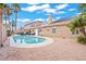 This backyard pool is surrounded by desert landscaping and palm trees at 9031 W Viking Rd, Las Vegas, NV 89147