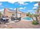 A backyard featuring a pool and outdoor seating, ideal for outdoor enjoyment and relaxation at 9031 W Viking Rd, Las Vegas, NV 89147
