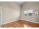 This bedroom features natural light, a wood floor, and ample space at 9031 W Viking Rd, Las Vegas, NV 89147