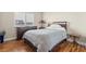 This bedroom features neutral paint, laminate wood flooring, and closet space at 9031 W Viking Rd, Las Vegas, NV 89147