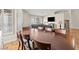 Spacious dining room features a large dining table with seating for eight and wood flooring at 9031 W Viking Rd, Las Vegas, NV 89147
