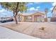 Attractive home with low-maintenance landscaping, a tiled roof, and a private courtyard entrance at 9031 W Viking Rd, Las Vegas, NV 89147