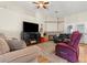 Inviting living room features a fireplace, ceiling fan, and comfortable seating at 9031 W Viking Rd, Las Vegas, NV 89147