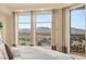 Inviting bedroom with mountain views, lots of natural light, and balcony access at 9101 Alta Dr # 1205, Las Vegas, NV 89145