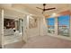 Bedroom featuring neutral walls, city views and an open doorway to a living room space at 9101 Alta Dr # 1205, Las Vegas, NV 89145