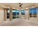 Large bedroom with a ceiling fan, balcony access, and expansive city and mountain views at 9101 Alta Dr # 1205, Las Vegas, NV 89145
