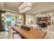 Formal dining area with light-colored walls, a large rectangular table and mirrored wall art at 9101 Alta Dr # 1205, Las Vegas, NV 89145