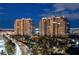 Luxury high-rise buildings with resort-style landscaping and palm tree-lined drive at 9101 Alta Dr # 1205, Las Vegas, NV 89145