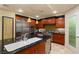 Contemporary kitchen with island, stainless appliances, and stylish fixtures at 9101 Alta Dr # 1205, Las Vegas, NV 89145