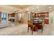 Open-concept kitchen with island seating, modern stainless steel appliances, and access to living area at 9101 Alta Dr # 1205, Las Vegas, NV 89145