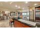 Modern kitchen with island seating, stainless steel appliances, and view to living areas at 9101 Alta Dr # 1205, Las Vegas, NV 89145