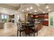 Modern kitchen with island seating, stainless steel appliances, and seamless flow to living areas at 9101 Alta Dr # 1205, Las Vegas, NV 89145