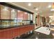 Kitchen with dark countertops, mosaic backsplash, wood cabinets, and stainless steel fixtures at 9101 Alta Dr # 1205, Las Vegas, NV 89145