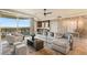 Spacious living room featuring a wet bar, plush seating, and scenic views from the balcony at 9101 Alta Dr # 1205, Las Vegas, NV 89145