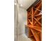 Close up view of a custom built-in wine rack featuring a wine refrigerator at 9101 Alta Dr # 1205, Las Vegas, NV 89145