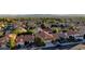 Aerial view of a residential neighborhood showcasing tree-lined streets and well-maintained homes, highlighting community charm at 9909 Barrier Reef Dr, Las Vegas, NV 89117