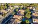 View of a community featuring well-spaced homes, lush landscaping, and inviting pools, offering a serene lifestyle at 9909 Barrier Reef Dr, Las Vegas, NV 89117