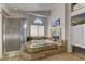 A luxurious bathroom featuring a raised tub, glass shower, and elegant finishes at 9909 Barrier Reef Dr, Las Vegas, NV 89117