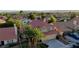 Charming two-story home with a well-manicured lawn, palm trees, and a spacious two-car garage at 9909 Barrier Reef Dr, Las Vegas, NV 89117