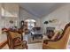 Spacious living room with vaulted ceilings, a fireplace, and luxurious seating arrangements, exuding warmth at 9909 Barrier Reef Dr, Las Vegas, NV 89117