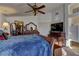 Spacious main bedroom with a large bed, dresser, and closet access at 9909 Barrier Reef Dr, Las Vegas, NV 89117