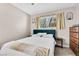 Bedroom with a teal headboard bed, natural light, and minimalistic decor at , Las Vegas, NV 89121