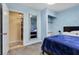Cozy bedroom with blue walls, closet, and doorway leading to another room at , Las Vegas, NV 89121
