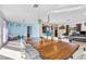 Open dining area with a large wood table, modern chairs, and great natural light at , Las Vegas, NV 89121