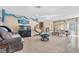 This spacious living room features tile floors, a stone fireplace, stylish seating and open concept floorplan at , Las Vegas, NV 89121