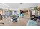 Bright living room features stylish furniture, bar seating, and tiled flooring for modern comfort at , Las Vegas, NV 89121