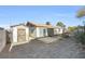 View of backyard with shed and covered patio area; perfect for outdoor enjoyment at 100 Grandview Dr, Henderson, NV 89002