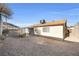 The backyard showing the home's exterior, including the roof and windows at 100 Grandview Dr, Henderson, NV 89002