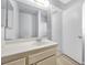 Bright bathroom featuring a single sink vanity and a large mirror reflecting a shower at 100 Grandview Dr, Henderson, NV 89002