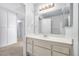 Well-lit bathroom with vanity, mirror, and a separate toilet room at 100 Grandview Dr, Henderson, NV 89002